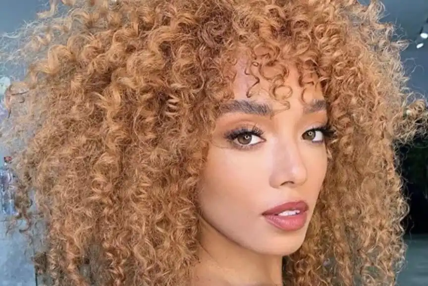 Curly hairstyles with bangs 2025